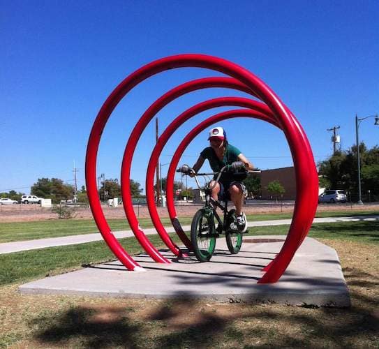 BMX rider in red spiral feature